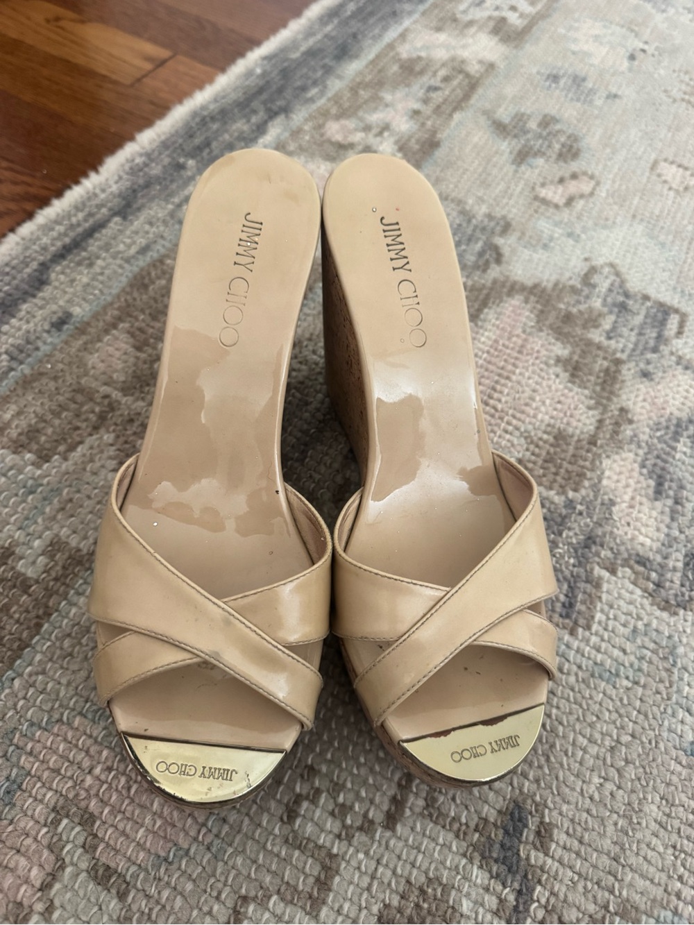 Jimmy Choo Beige Patent Leather Crisscross Wedge Mules with Gold Toe Accent